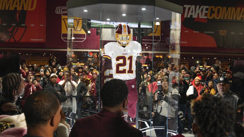 Fans attends the unveiling of the Sean Taylor Memorial, before the start of an NFL football game between the Atlanta Falcons and Washington Commanders, Sunday, Nov. 27, 2022, in Landover, Md.