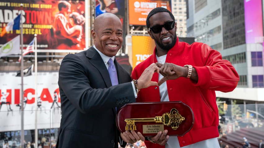 This photo provided by the Office of the New York Mayor, shows Mayor Eric Adams, left, presenting the Key to the City to hip-hop artist Sean “Diddy” Combs in New York’s Times Square, Friday, Sept. 15, 2023.