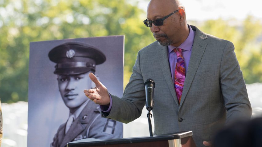 FILE – Steve Woodson speaks during a medal ceremony for his father, Cpl. Waverly B. Woodson Jr., to be posthumously honored with the Bronze Star and Combat Medic Badge, Oct. 11, 2023 at Arlington National Cemetery in Arlington, Va. Woodson Jr., a medic who was part of the only Black combat unit to take part in the D-Day invasion of France, is being posthumously awarded the Distinguished Service Cross. It’s the military’s second highest honor. The announcement was made Monday, June 3, 2024, by Sen. Chris Van Hollen of Maryland.