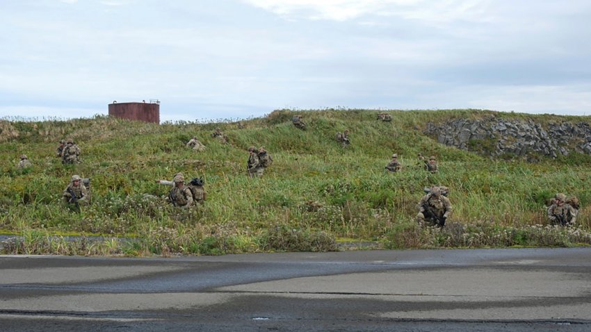 In this image released by the U.S. Army, U.S. Army soldiers assigned to 1st Battalion, 501st Parachute Infantry Regiment, 2nd Infantry Brigade Combat Team (Airborne), 11th Airborne Division, maneuver through the thick terrain of Shemya Island, Alaska, as part of a force projection operation to the remote island in the North Pacific Ocean, Sept. 13, 2024.