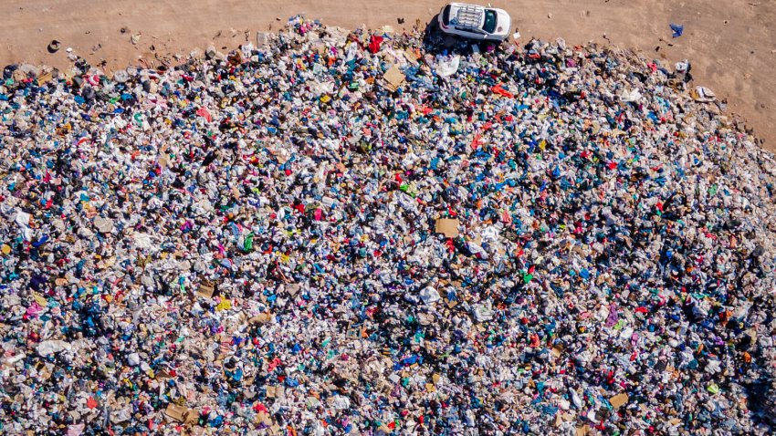 25 November 2021, Chile, Alto Hospicio: Used clothes sit in a landfill in the desert. In the nearby free trade zone of Iquique, 29,178 tons of used clothing arrived in 2021 through October. About 50 importers sell the best pieces from them, while the others – an estimated 40 percent – sort them out.  (to dpa “Chile’s Atacama Desert: Graveyard for Used Clothes”) Photo: Antonio Cossio/dpa (Photo by Antonio Cossio/picture alliance via Getty Images)