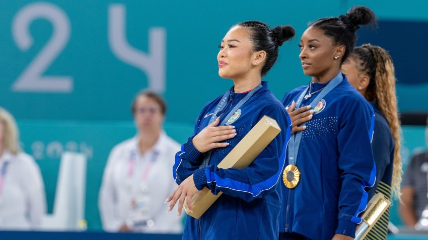 US athlete Simone Biles, who won the gold medal in the competition, Brazilian athlete Rebeca Andrade who won the silver medal and US athlete Sunisa Lee, who won the bronze medal, pose at the podium at the artistic gymnastics women's all-around final of the Paris 2024 Olympic Games at the Bercy Arena in Paris, France on August 01, 2024.