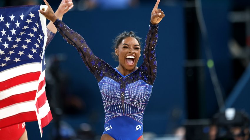 Gold medalist Simone Biles of Team United States celebrates after competing in the Artistic Gymnastics Women's All-Around Final on day six of the Olympic Games Paris 2024 at Bercy Arena on August 01, 2024 in Paris, France.