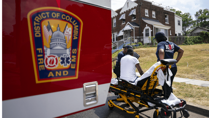 Emergency medical technicians (EMTs) treat a patient following a kitchen fire during high temperatures in Washington, DC, US, on Sunday, June 23, 2024. New York, Washington and the middle Atlantic region will bake through another day of hot, sticky weather, pushing temperatures close to record highs before thunderstorms arrive to briefly cool things off. Photographer: Al Drago/Bloomberg via Getty Images